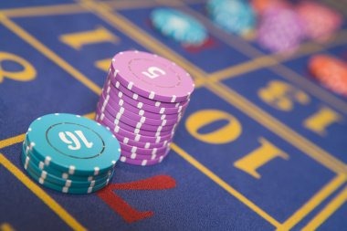 Roulette wheel spinning in real-time with betting board displayed on screen